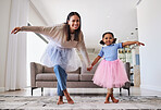 Ballet, mother and girl child in a home living room with happy quality time and mama love. Dance, dancing exercise and dancer workout of a mom and kid with happiness, smile and youth cardio training
