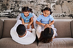 Children, family and laugh with a girl, sister and parents having fun on a sofa at home together from above. Kids, love and humor with a mother, father and daughter siblings bonding in a house