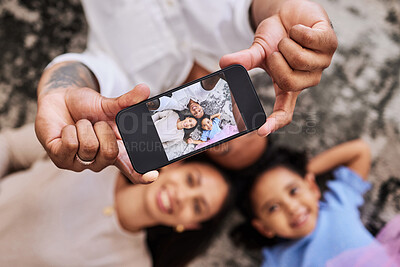 Buy stock photo Family, hands and phone for selfie photo relaxing on the floor with smile for fun, bonding and moments together. Hand of happy father, mother and child smiling for picture perfect image on smartphone