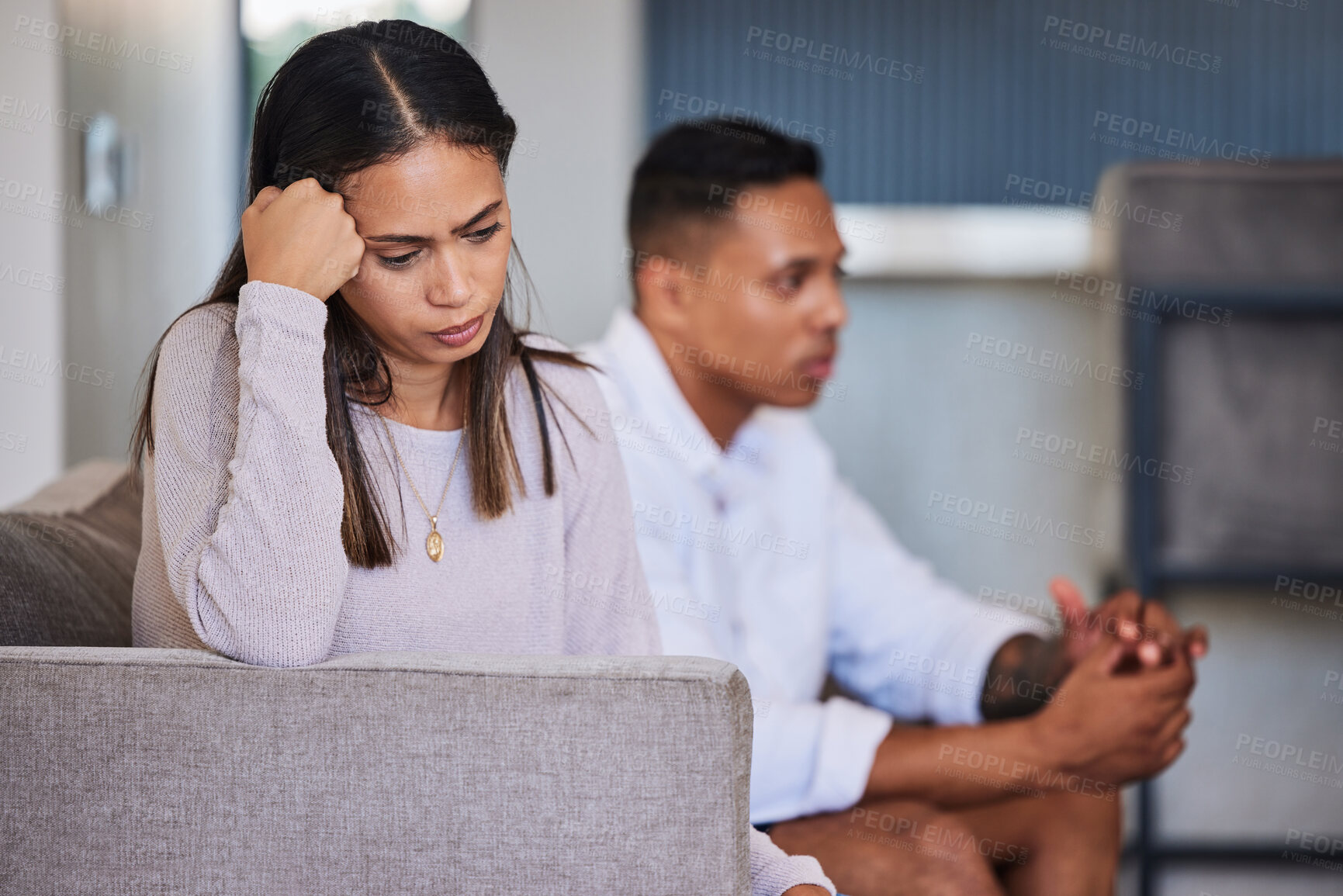 Buy stock photo Sad, woman and couple in unhappy marriage from argument, fight or disagreement on living room sofa at home. Upset female with married problems, trouble or issues with husband in divorce or breakup