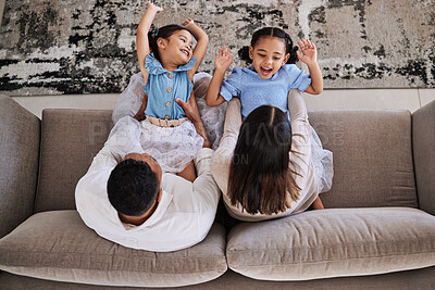 Buy stock photo Happy girl children, family and house living room with parents playing with energy on a sofa. Mother, father and kids with love, quality time and care in a home with a smile and happiness having fun 