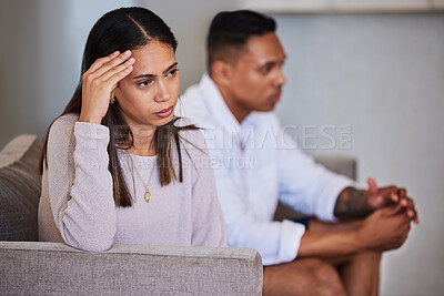 Buy stock photo Divorce, sad and fight with couple on sofa  with marriage problems feeling frustrated, conflict or angry. Thinking, therapy or counseling with man and woman in living room for fail, decision or fear