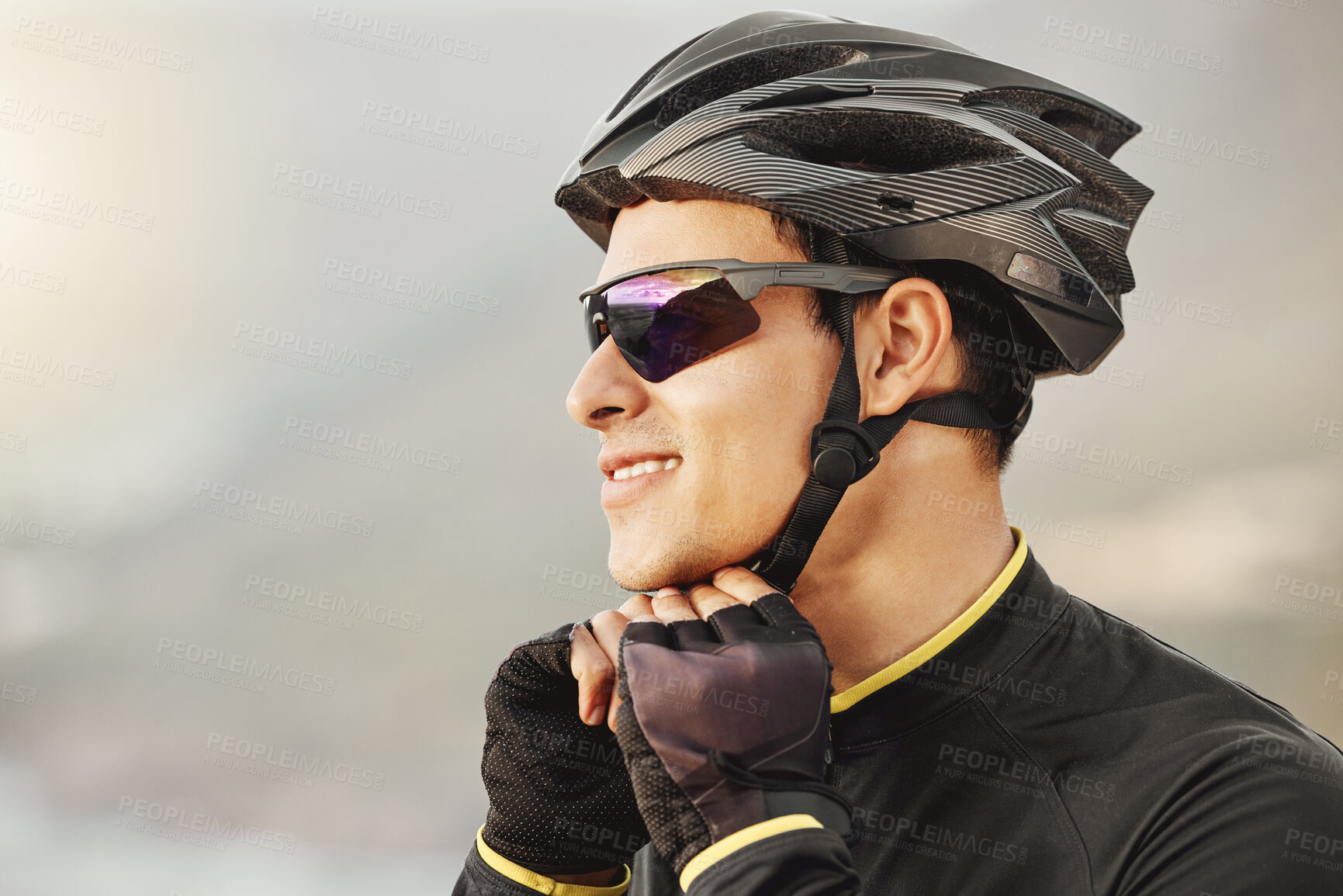 Buy stock photo Fitness, sports and cyclist checking his helmet before cycling, training, workout and cardio ride in nature. Health, biking and athletic man getting ready for cycle, happy, smile and relaxed training