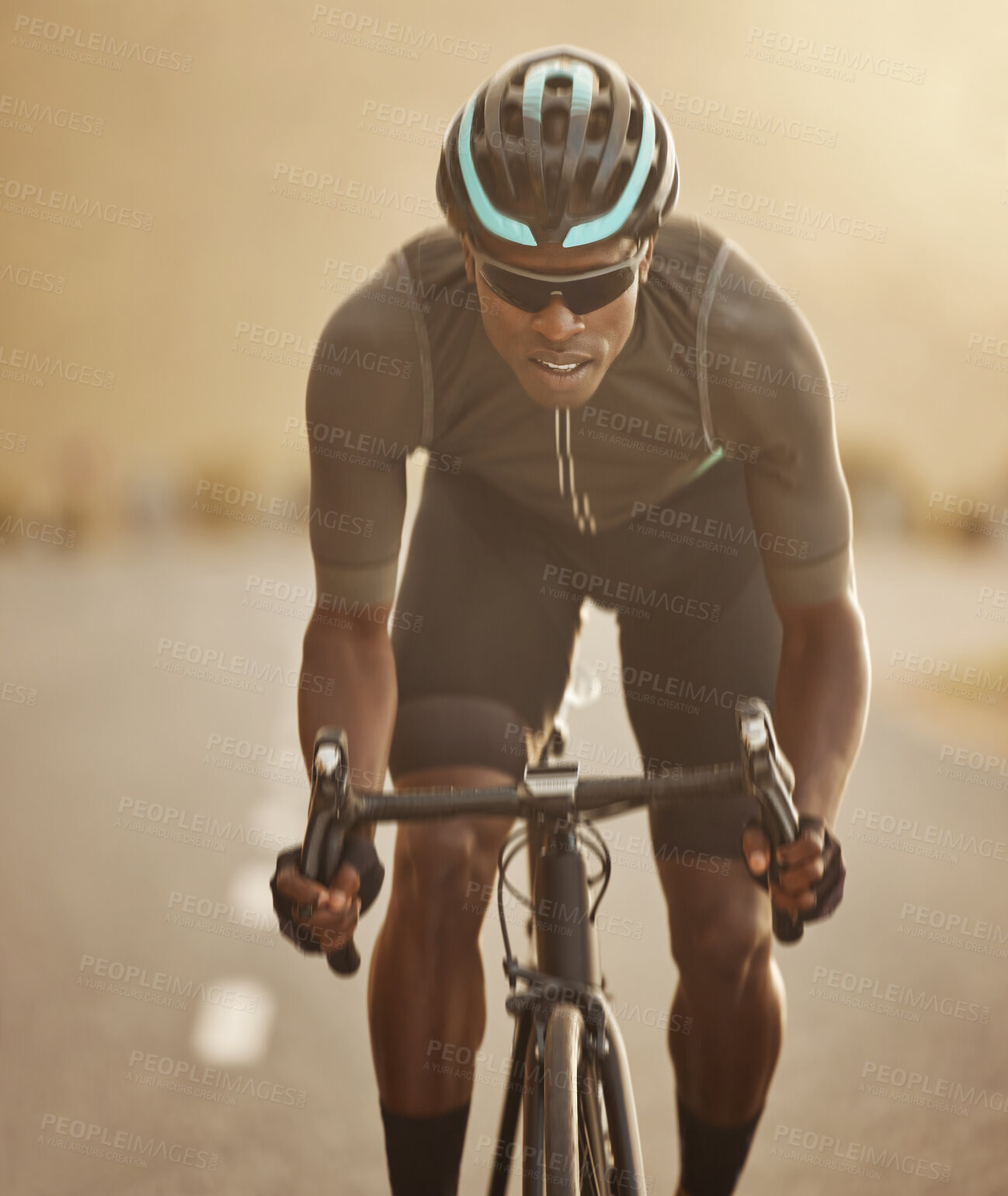 Buy stock photo Fitness, sports and cycling man workout in a road at sunset, health, wellness and morning cardio exercise. Energy, speed and focus power by athletic black man cycling on bicycle for marathon training