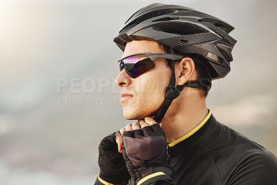 Buy stock photo Cycling, helmet and sunglasses with a sports man being safe while outdoor for a ride on a cloudy day. Safety, cycle and fitness with a male athlete outside to exercise or workout for cardio health