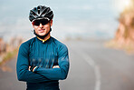 Sports man, vision and cycling success by cyclist on mountain route road with arms folded, power and health. Fitness, sport and performance goal by guy athlete looking proud, ready and strong mindset