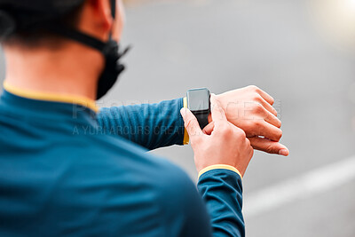 Watch, fitness and man doing a workout, exercise or outdoor cardio in the city road for motivation. Hands of an athlete with monitor of time during training with sports technology in the street