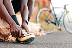 Fitness, ready and man with cycling shoes by his bicycle starting his workout, cardio exercise and training journey. Sports, healthy and African athlete biker wearing cleats for a road adventure