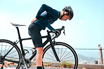 Bicycle, man and back pain, fitness and injury with exercise and muscle ache, workout outdoor in nature. Athlete, cyclist and backache in city, sore and inflammation, bike training active lifestyle.