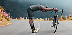 Sports man, stretch and cycling break along mountain route by cyclist resting during fitness, exercise and morning cardio. Stretching, bicycle and black man stop for rest during physical performance