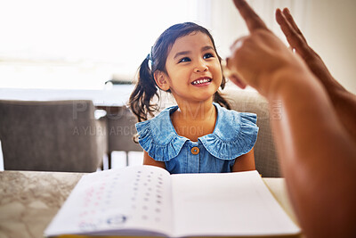 Buy stock photo Education, homeschool and a kindergarten girl with smile, notebook and help from mother in math class. Home school, happy child and learning to count on fingers and hands, woman teaching kid maths.