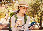 Phone, coffee and travel with a woman backpacker using 5g mobile technology for directions or navigation in a park. Social media, tourism and communication with a young woman typing a text message