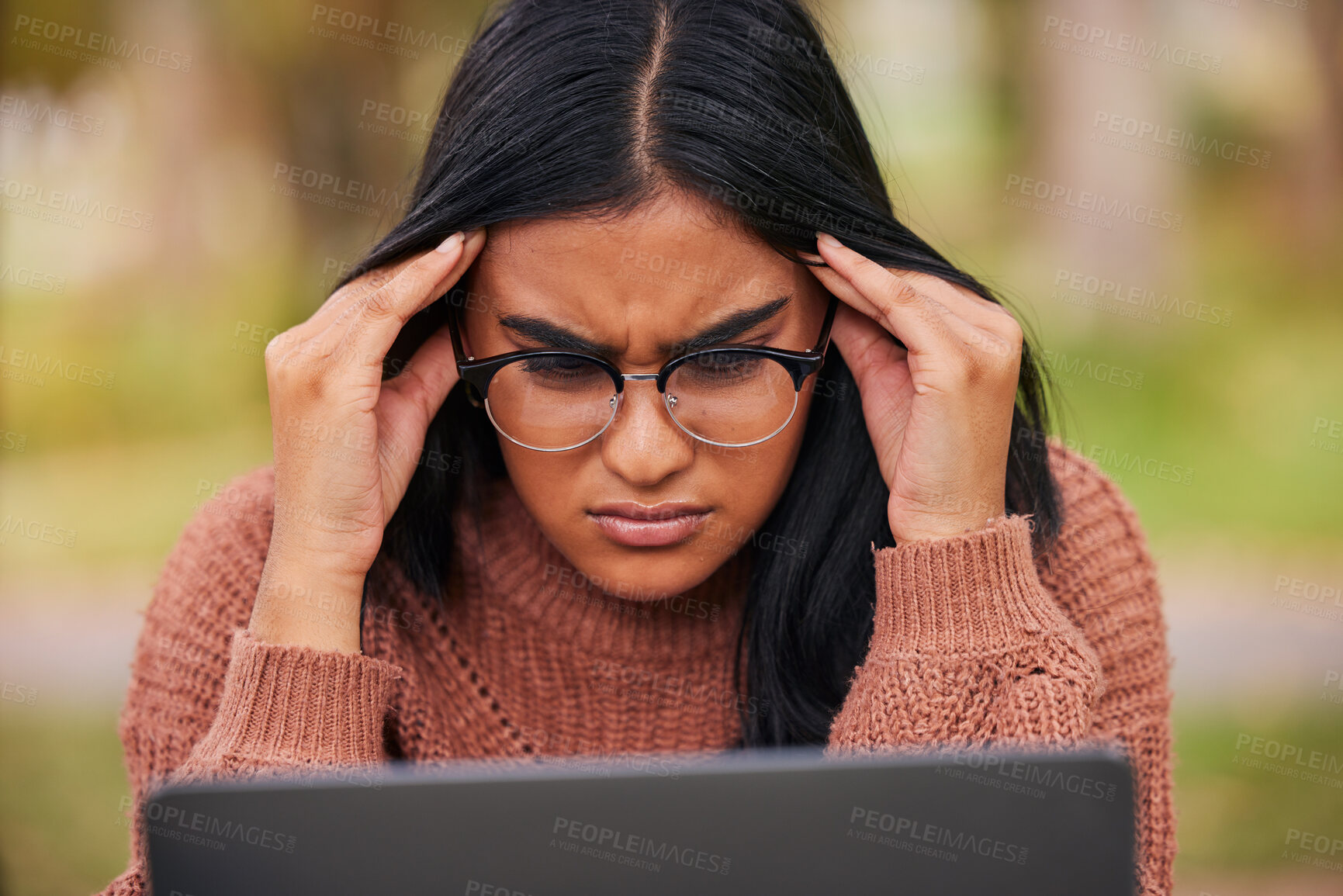 Buy stock photo Study, university and laptop student stress at campus with anxiety for a test. Scholarship woman with headache, frustrated and studying outdoor. Burnout in education, learning and confused about exam