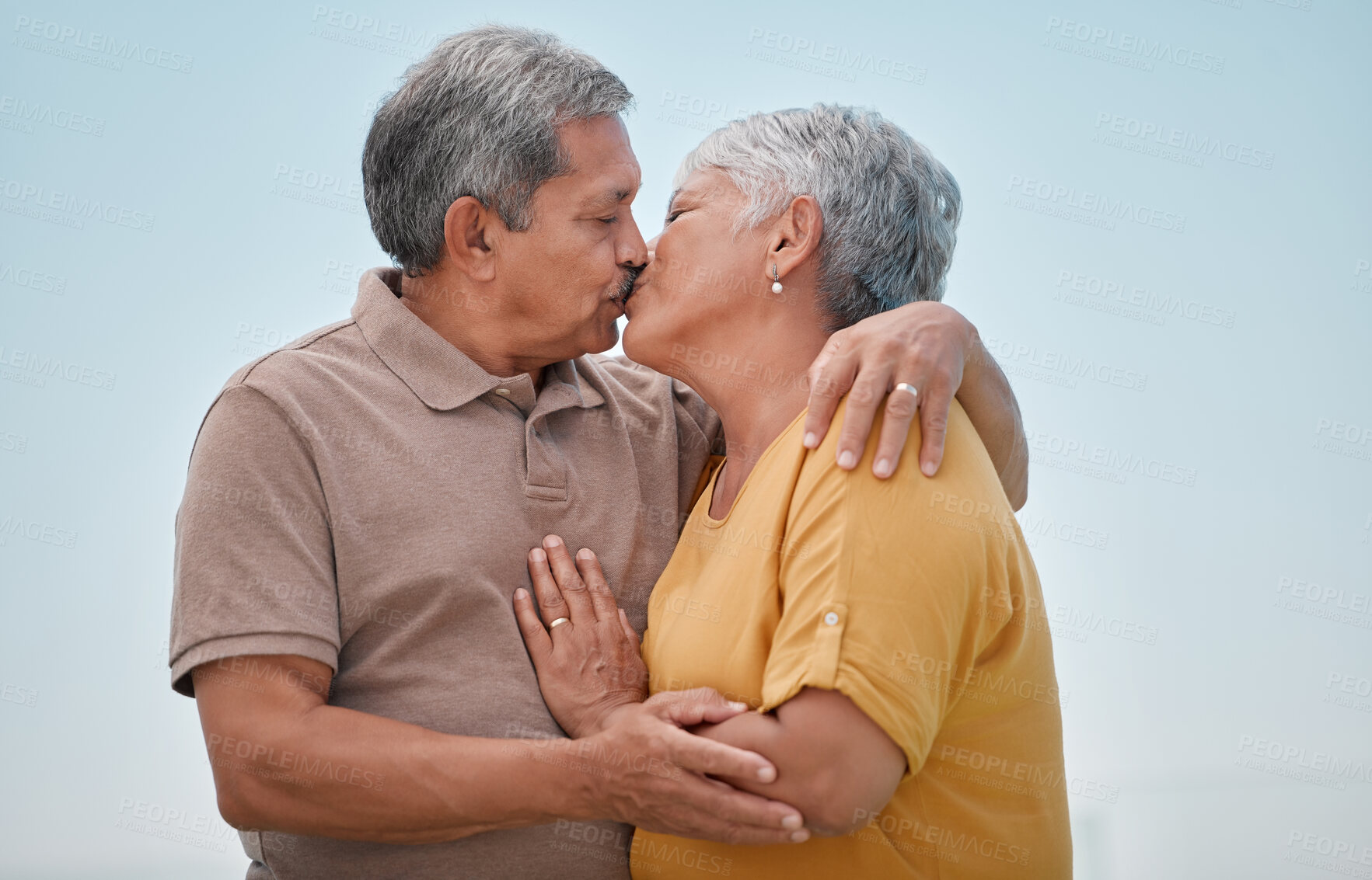 Buy stock photo Love, romance and old couple kiss on marriage anniversary holiday vacation in retirement outdoors. Elderly, trust and senior woman kissing and enjoying romantic quality time with partner in Bogota