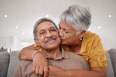 Buy stock photo Senior couple, hug and kiss while bonding on sofa in house or Mexico home living room in safety, love or security. Portrait, smile and happy retirement elderly man and woman with life insurance trust