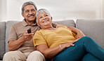 Senior couple, relax and watching tv on sofa in home living room. Retirement, love and elderly, man and woman streaming on television, movie or online video and spending quality time together.

