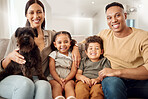 Love, family and dog with kids and parents on sofa in living room for happy, smile and care. Portrait, relax and pet with man, children and woman together at home for happiness, support and wellness