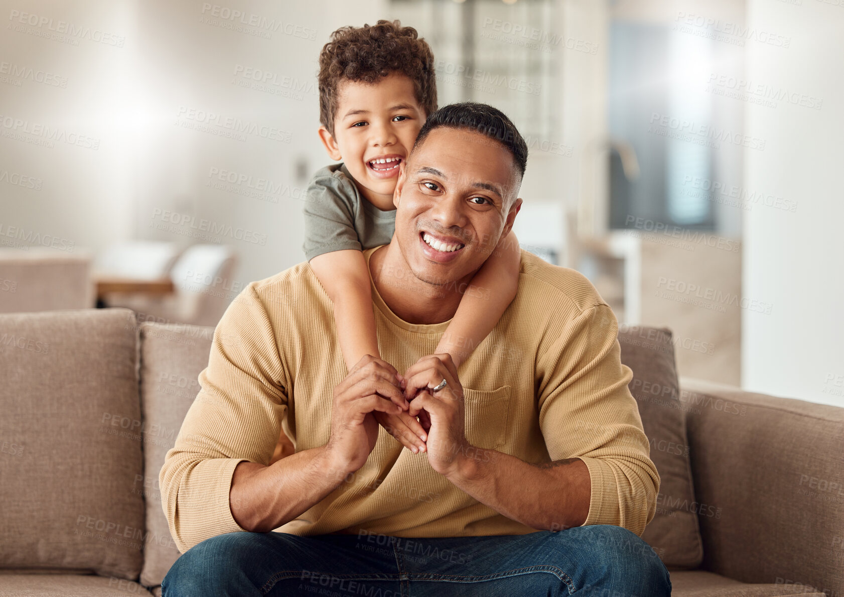 Buy stock photo Family, love and trust with a father and son sitting on a sofa in the living room of their home while bonding together. Children, portrait and smile with a young man and boy child in a house to relax