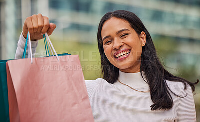 Buy stock photo Face, smile and woman with shopping bags in city after shopping at retail shop, store or mall for clothing sale. Portrait, fashion and young female from India happy with sales purchase from boutique.