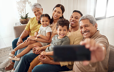 Buy stock photo Phone, selfie and happy family on a sofa with people relax, smile and bond in a living room. Children, parents and grandparents smiling for photo while enjoying quality time on a couch in their home