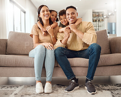Buy stock photo Hug, children and parents on the sofa in their living room for care, love and smile together in house. Portrait of happy, relax and young kids hugging mother and father with affection on the couch