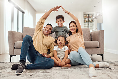 Buy stock photo Roof, children and parents with security in their house with love, care and safety in the living room together. Portrait of happy, smile and young mother and father with insurance for their family