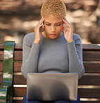 Black woman, laptop and stress for exams, being anxious and headache for studies, outdoor and on bench. Female student, young lady and with digital device with anxiety, for results and burnout.