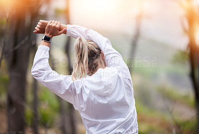 Buy stock photo Stretching, arms and woman training in the woods for fitness, marathon and body goal in nature. Back of an athlete doing a warm up before running, exercise and an outdoor workout in the forest