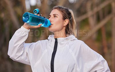 Buy stock photo Fitness, health and runner woman with water bottle for hydration break on cardio run in nature. Training, running and healthy lifestyle of athlete girl with drink for workout, exercise and sport.