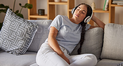 Buy stock photo Relax, music and peace with woman on sofa with headphones for sleeping, podcast or wellness. Technology, streaming and service with girl in living room listening for calm, spiritual and lifestyle