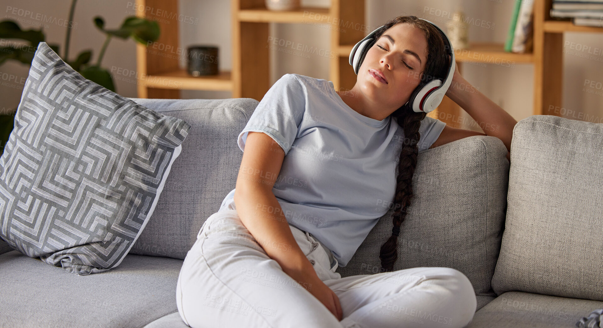 Buy stock photo Relax, music and peace with woman on sofa with headphones for sleeping, podcast or wellness. Technology, streaming and service with girl in living room listening for calm, spiritual and lifestyle