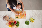 Development, child and mother in kitchen, with vegetables and learn cooking together being happy, smile and safety. Mama, daughter and girl with food, childcare and cutting veggies and organic dinner
