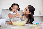 Development, mother and girl in kitchen, cooking and baking for learning, growth and being happy together at home. Mama, daughter and child have fun while education, food and with happiness in home. 
