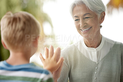 Buy stock photo Covid, grandmother and child touching window for safety, social distancing and risk in covid 19 pandemic. Family, love and boy connect hand with grandma on glass in isolation, quarantine and lockdown