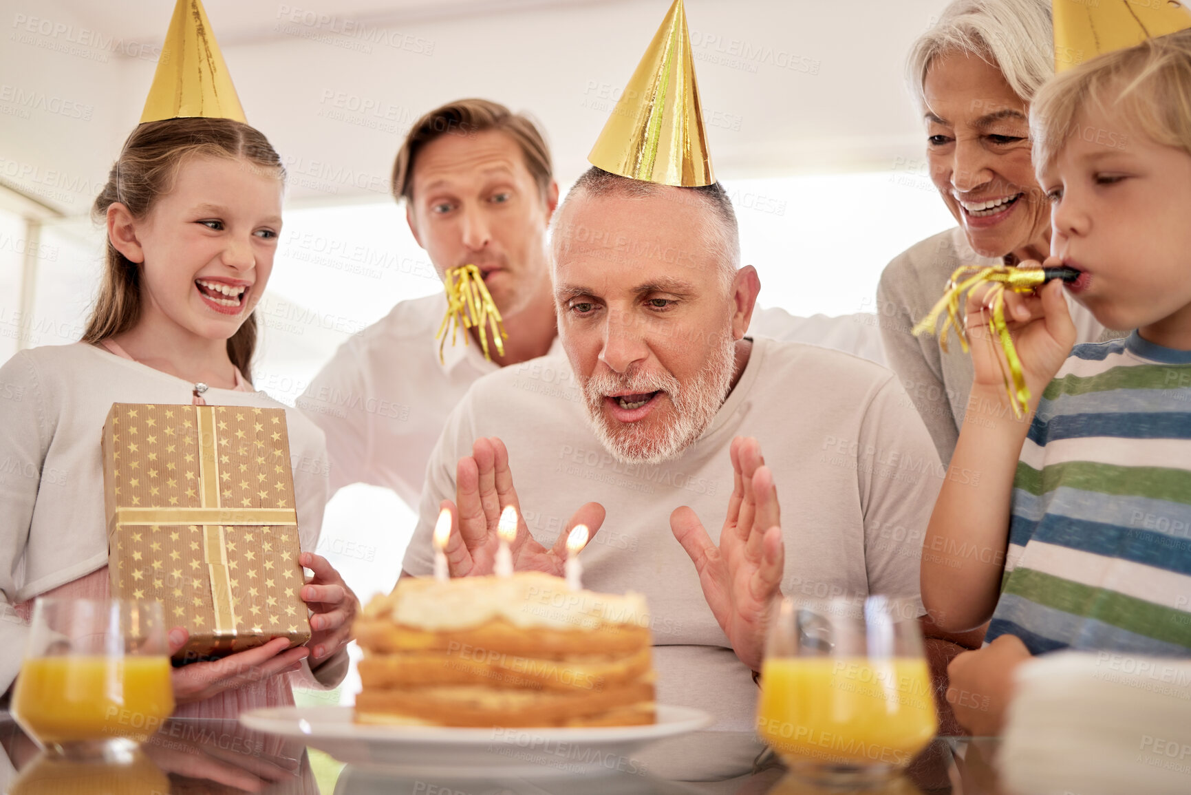 Buy stock photo Birthday cake, celebration and grandfather with family children singing, excited and celebrate together. Elderly, senior man with kids, gift box present for fathers day, retirement or birthday party