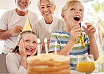 Happy birthday, family and girl with a cake in a party celebration with grandparents and excited sibling or brother. Smile, happiness and young child celebrates, laughing and enjoying a special day
