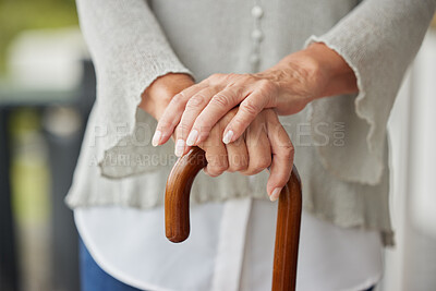 Buy stock photo Hands, walking cane and senior woman with disability leaning for help, balance and support at nursing or retirement home. Hand, mature and mobility stick for disabled elderly lady in physical therapy