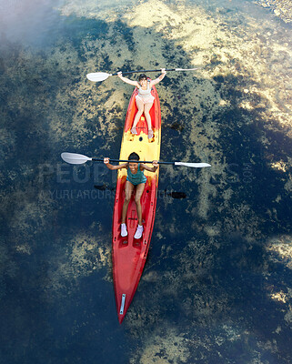 Buy stock photo Friends kayak adventure, success and sport teamwork travel together outdoors. Happy women celebrate, cheering and winner paddle on vacation, river holiday or summer happiness break aerial view
