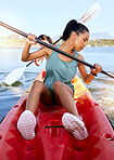 Lake, friends and kayak adventure with water sport on travel trip canoeing, kayaking and using paddle on calm nature river. Exercise, vacation or holiday with women enjoying boat activity in summer