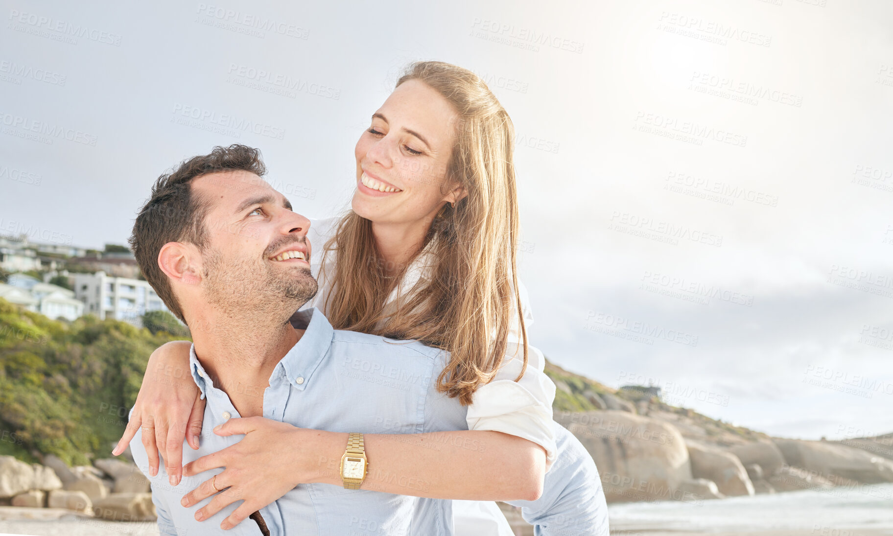 Buy stock photo Love, beach and couple piggy back for tender moment of romance and happiness in Los Angeles. Romantic relationship with happy people dating and bonding while playing at ocean getaway in the USA.


