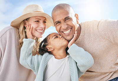 Buy stock photo Happy family, mother and father with a kiss from a child on the face in summer outdoors on a weekend. Interracial, mama and girl loves kissing dad with a big smile on cheek on sunny holiday vacation