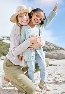 Buy stock photo Love, mother and girl on beach, bonding and relax for holiday vacation and outdoor together. Mama, daughter and happy kid with smile, embrace and hug on seaside sand, in summer and adventure travel.