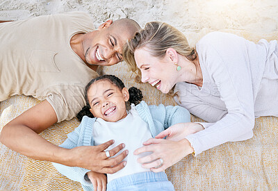 Buy stock photo Top view, happy family and relax at beach on holiday, vacation or summer trip. Diversity, love and man, woman and girl bonding, care and spending quality time together on sandy, sea or ocean shore.
