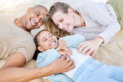 Buy stock photo Happy, mother and father with kid lying on the beach in playful happiness laughing in family bonding in the outdoors. Mama, dad and child playing in the sand together with smile for relationship