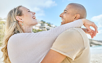 Buy stock photo Beach, hug and interracial love of couple with happy and cheerful smile enjoy vacation in Brazil. Happiness, care and romance of lovers embracing for joyful moment on ocean holiday break.
