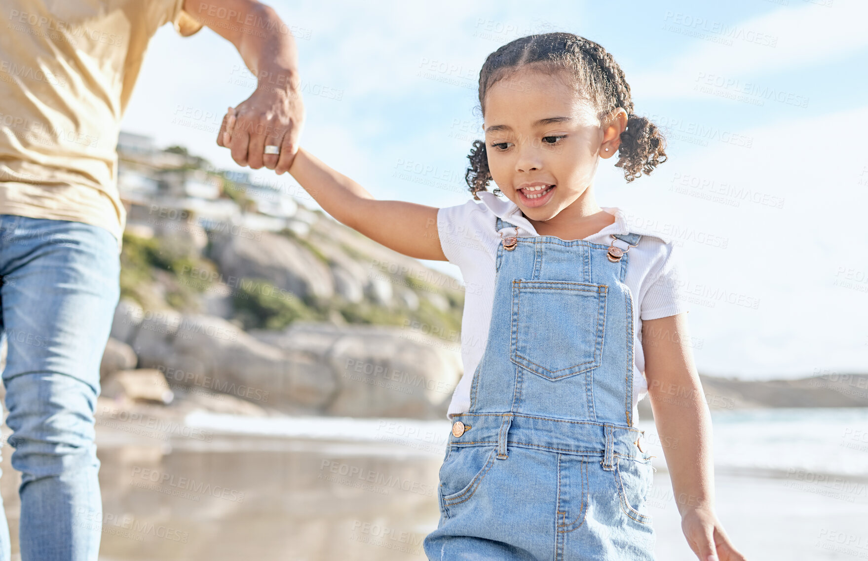 Buy stock photo Beach, holding hands and child walking outdoor in sunshine for summer, holiday travel or vacation with family or father support, help and love. Girl kid, parent and ocean or sea water fun bonding