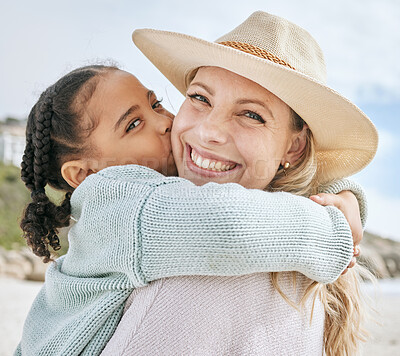 Buy stock photo Beach, holiday and girl kiss mom on her cheek hugging, embrace and holding each other. Love, affection and portrait of mother and child bonding on family vacation by the sea, enjoying summer together