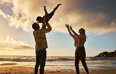 Buy stock photo Family, beach and fun with a girl, mother and father by the sea for summer vacation or holiday at sunset. Travel, children and ocean with a man, woman and daughter playing or bonding on the sand