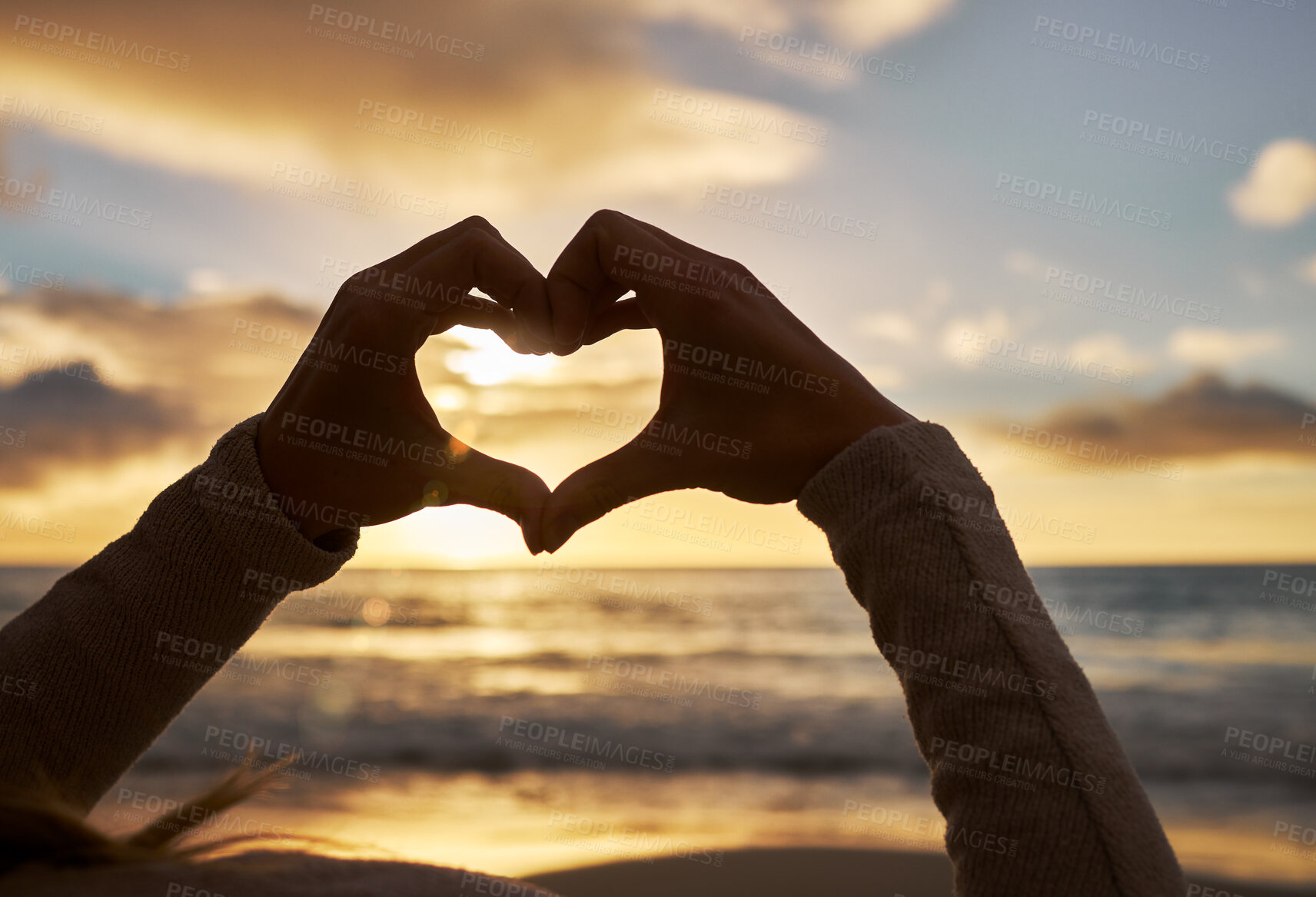 Buy stock photo Beach, love and hands with sunset clouds for peaceful and calm evening horizon view in Mexico. Summer, care and heart hand girl with tranquil ocean sunlight on water and beautiful twilight sky.