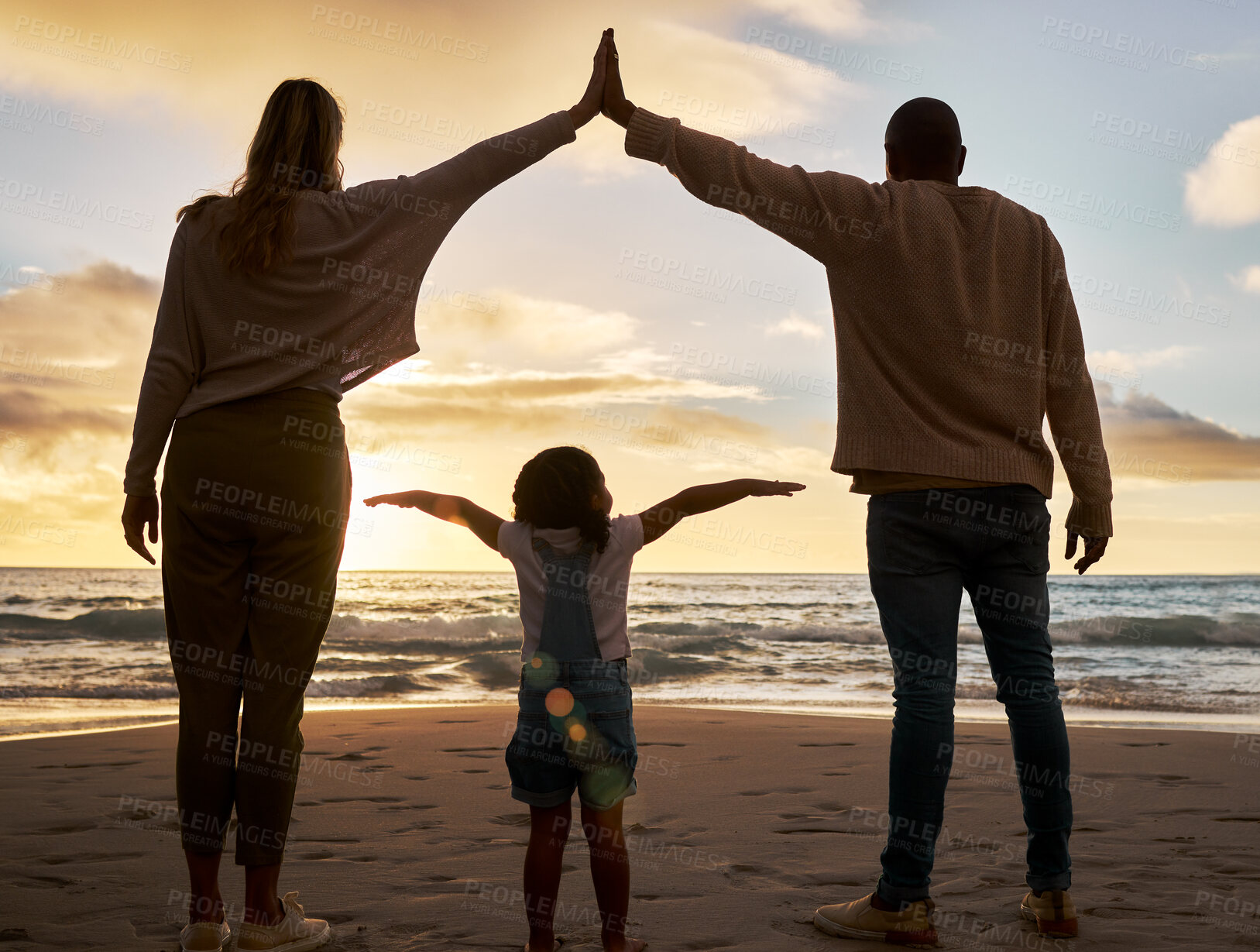 Buy stock photo Beach, love and family in unity together while on summer vacation, journey or adventure at the sea. Mother, father and girl child bonding in nature by the ocean water with sunset on seaside holiday.